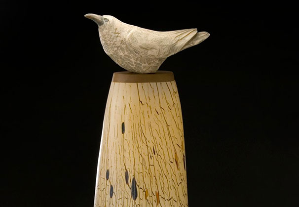 <i>White Raven Spirit Jar</i> (with Hib Sabin); 25 x 9 1/2 x 7 1/2 inches; blown and sculpted glass, carved juniper, oak

