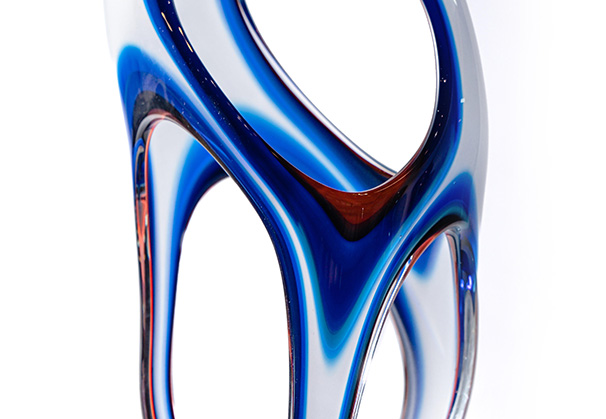 <i>Misty Gust Dilation, 2022</i>; 20 x 9 x 7 inches; blown and hot sculpted glass, cast cement base 
