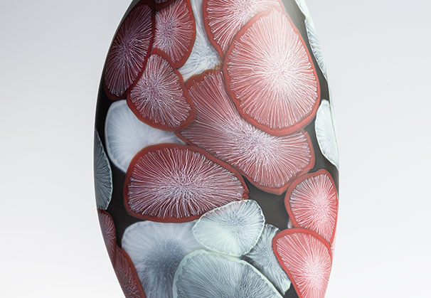 <i>Light Time, Red on Dark Grey</i>, 2026; 16.25 x 9.5 x 6.25 inches; blown glass with cane drawn additions, sandblasted, and pumice polished