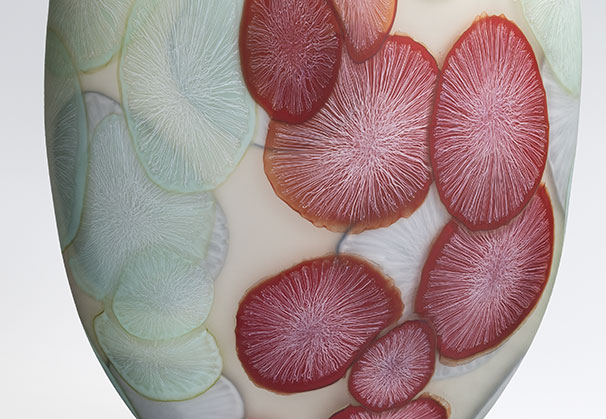 <i>Light Time, Red on Ivory</i>, 2026; 17.75 x 11 x 6.25 inches; blown glass with cane drawn additions, sandblasted, and pumice polished