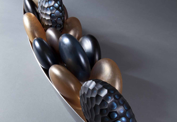 <i>Bateau Roues Bleues</i>, 2011; blown glass spheres with cold work in a metal boat; 43-1/4 x 7 x 10 inches