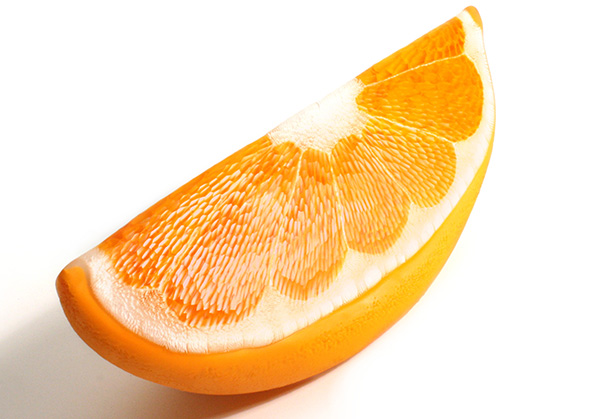 <i>Orange Wedge</i>, 2023; 14 x 5 x 6 inches; blown and carved glass