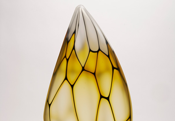 <i>Gold, White, and Black Murrine Form</i>, 2023; 22 x 9 x 7 inches; blown glass
