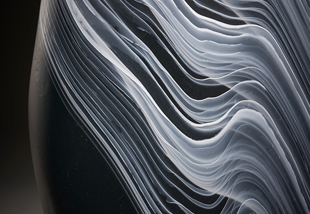 <i>Black and White Striated Form</i>, 2022; 26 x 8 x 4 inches; blown glass
