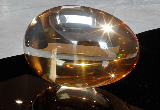 <i>Clear Plated Gold Egg 1/6</i>, 2024; 28.5 x 42 x 28.5 centimeters; clear optical glass
