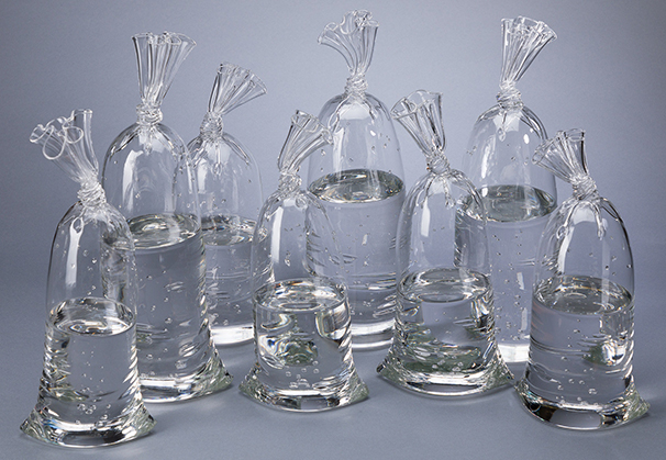 <i>H2O/Si02 Water Bags</i>; approximately 12 to 17 inches high x 5 to 6 inches wide; hollow and solid sculpted glass
