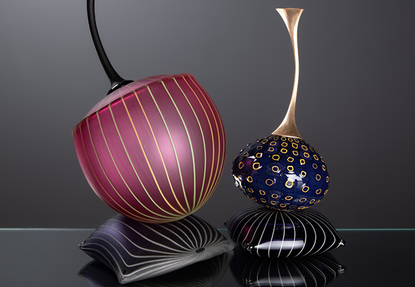 (LEFT) <i>Virginiana: #050123</i>, 2023; 425h x 240w x 220d millimeters; blown glass, cane, surface worked, assembled
(RIGHT) <i>de Árbol: #060123</i>, 2023; 360h x 150w x 150d millimeters; blown glass, cane, surface worked, brass stem, assembled 