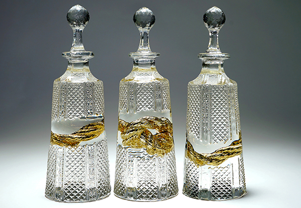 <i>The Golden Thread</i> (Hex Decanters), 2019; 11 x 11 x 3-1/2 inches; cast crystal, 24-carat gold mirror
