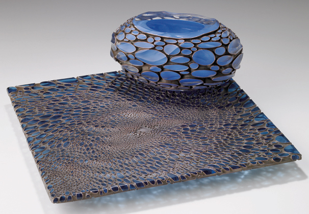 <i>Becalm</i>, 2009; Deeply engraved (wave cut) blown glass, deeply engraved (wave cut) industrial blue plate glass, and copper; 5 x 12 x 12 inches
