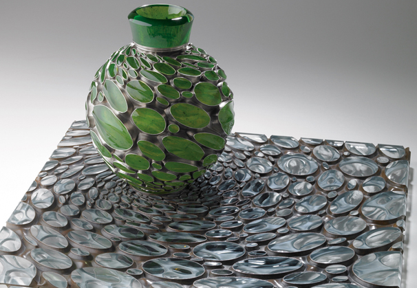 <i>Verdant Flow</i>, 2009; Deeply engraved (radiation cut) blown glass with uranium veil, deeply engraved (radiation cut) industrial plate glass, copper, and silver;11 x 20 1/2 x 20 1/2 inches