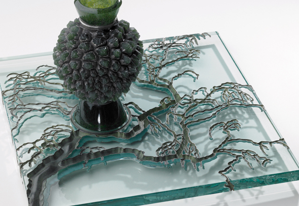 <i>Inside-Outside</i>, 2010; Cast glass object, industrial plate glass, copper, and silver; 9 1/2 x 15 x 15 inches