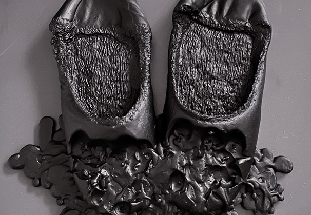 <i>Slippers</i>, 2025; 12.6 x 12.2 x 2 inches; lead crystal glass