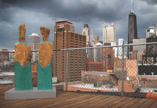(Left) <i>Your Kind #5</i>, 2010; 59 x 16 x 8 inches. (Right) <i>Your Kind #4</i>, 2010; 56 x 13 x 8 inches; both cast glass and stone