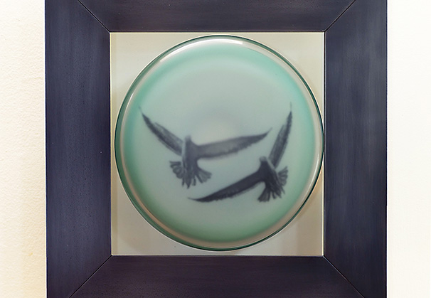 <i>Two Birds</i>, 2021; 13.5 h x 13.25 w x 4 d (inches); original image, screen-printed kiln-fired enamels, blown, sandblasted, mirrored glass, steel with patina and paint

