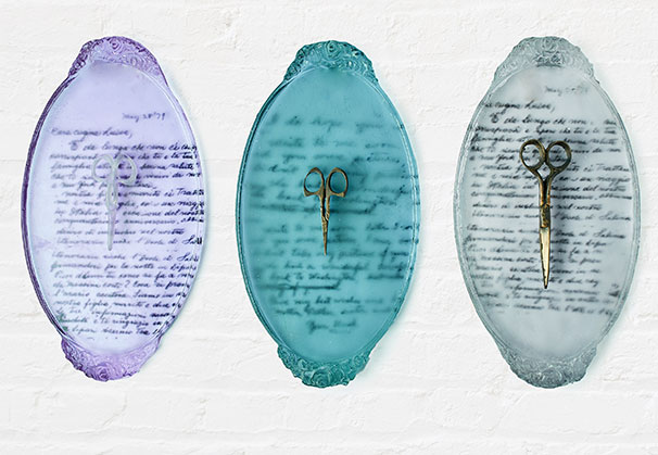 <i>Cutting Ties</i>, 2022;  each plaque 14 x 11 x 1 inches; cast glass, cast bronze
