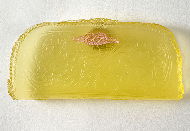 <i>Yellow Cowboy Purse</i>, 2025; 6 x 12 x 1.5 inches; cast glass, vintage chain