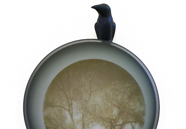 <i>Crow with Cottonwood</i>, 2015-2021; 26 h x 14.5 w x 4.5 d (inches); original image, screen-printed kiln-fired enamels, blown, sandblasted, mirrored glass, steel with patina and paint

