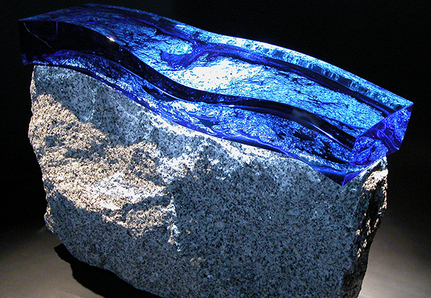 <i>Spirit of Stone</i>, 2004; 30 x 50 x 15 cm; blue optical glass, grey granite

