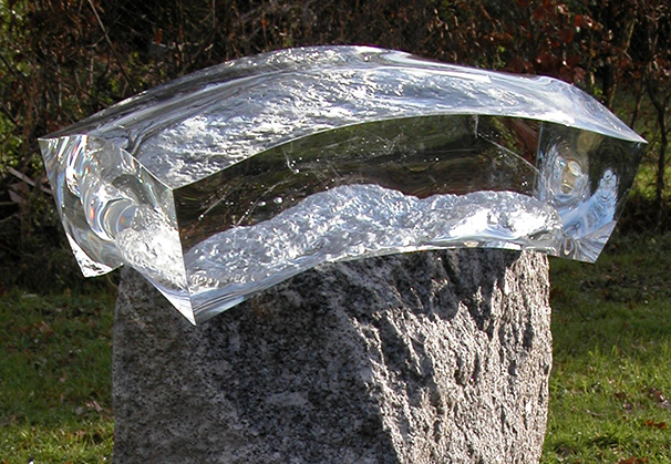 <i>A Captor</i>, 2013; 120 x 50 x 40 cm; clear optical glass, granite 
