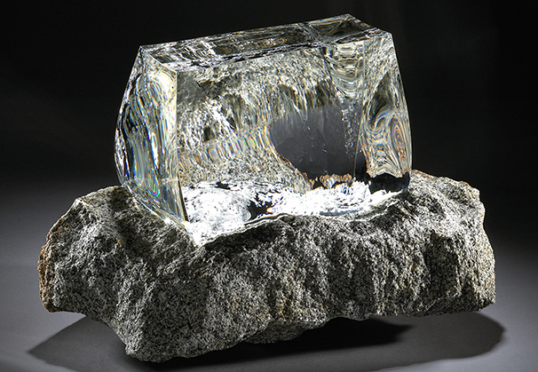 <i>Spirit of Stone</i> – white glass, 2004; 38 x 30 x 22 cm; clear optical glass, granite 
