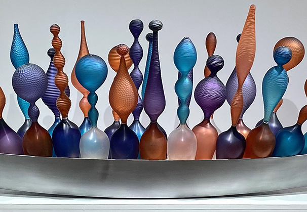 <i>Multicultural Ship of Hope</i>, 2017; 18 x 66 x 16 inches; free blown and carved glass, steel, sand