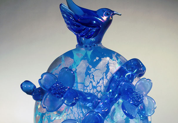 <i>Blue Tint Wren with Dogwoods Aqua</i>; 17.5 x 11 x 4.5 inches; blown and hot formed glass