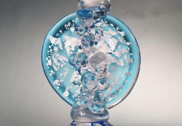 <i>Circular Regeneration Aqua with Pink Tint</i>; 29.5 x 12.5 x 7 inches; blown and hot formed glass