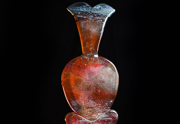 <i>Amber Red Bottle</i>, 1998; 29 x 10 x 5 inches; hot sculpted glass off the pipe