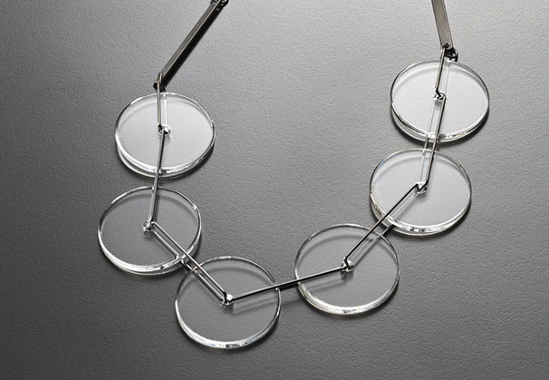 <i>Spin 01 necklace</i>, 2016; 6mm high x 210mm diameter; waterjet cut and flameworked borosilicate glass, titanium, oxidised 925 silver

