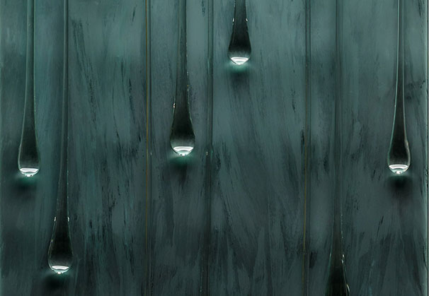 <i>Lullaby</i>, 2026; 61 x 30 x 3 inches; Atlantica tint, bent and etched glass with drops suspended on mild steel armature. Photo by Richard Kelly

