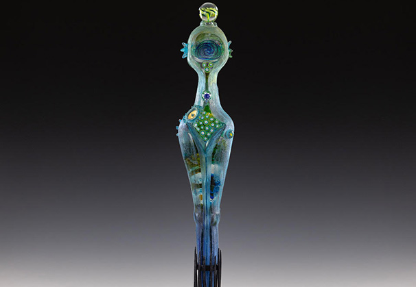 <i>Garden Grace with Metal Stand</i>, 2023; 64 x 16 inches;  cast glass with mixed media and inclusions