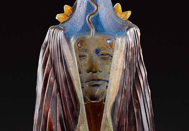 <i>Winged Garden Sentinel</i>, 2023; 47 x 9.5 inches; cast class with inclusions and copper wings
