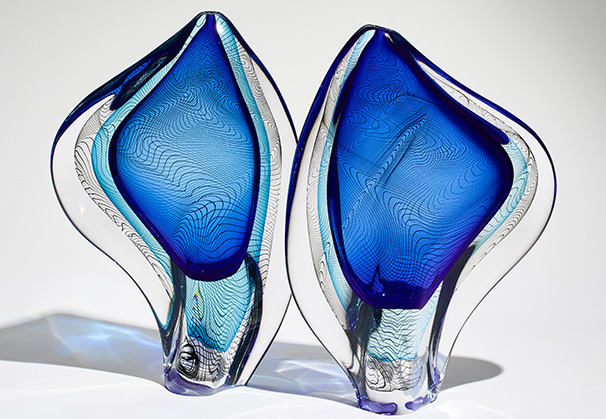 <i>Aurora - Blue Pair</i>, 2024; each approximately 38 x 23 x 7 centimeters; freeblown glass; Photo by Alick Cotterill