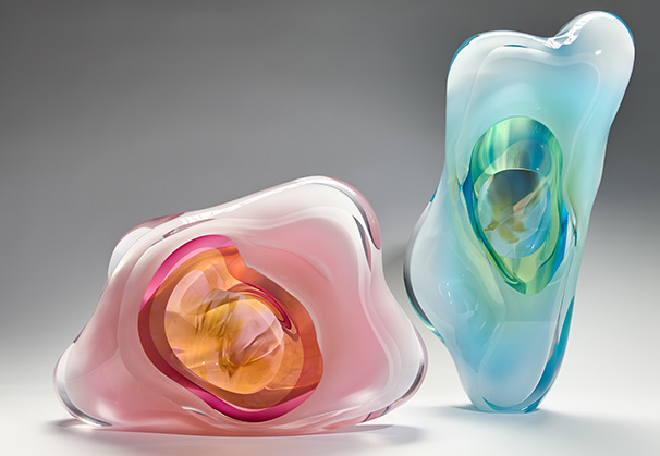 <i>Pink Wide Cloud & Emerald Tall Cloud I</i>, 2024; (l to r) 27 x 37 x 13 centimeters, 44 x 25 x 15 centimeters; freeblown glass, cut and polished; Photo by Alick Cotterill