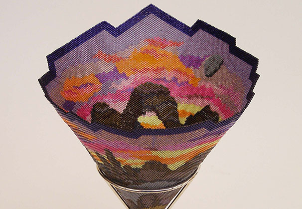 <i>Canyon</i>, vessel, 2016; 7 x 6.5 inches (11 inches high with silver stand); woven glass beads, tight weave