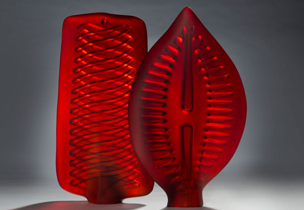 <i>Red Diatom Pair</i>, 2012; H 49 x W 20 x D 10cm & H 51 x W 23 x D 11cm; cast & blown tinted glass, carved