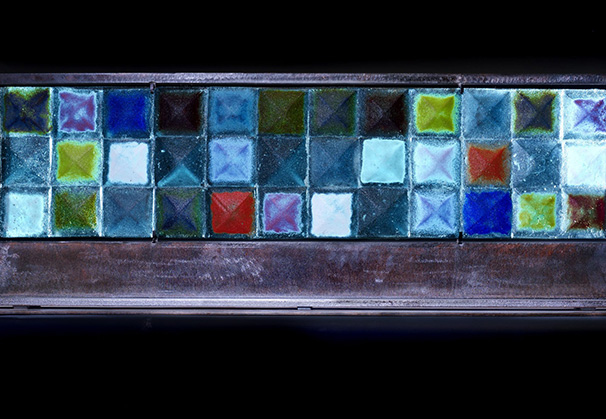 <i>Aqua Horizontal Pyramid Quilt</i>; 17 x 34 x 9 inches; sand cast glass with hand forged metal base