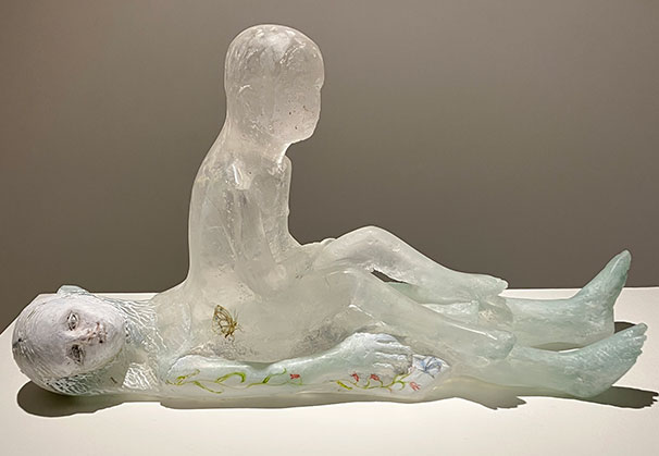 <i>AWAKENING</i> (soul rising out of body), 2022-2025; 14 x 25 x 6 inches; cast glass/ceramic/hand painted details