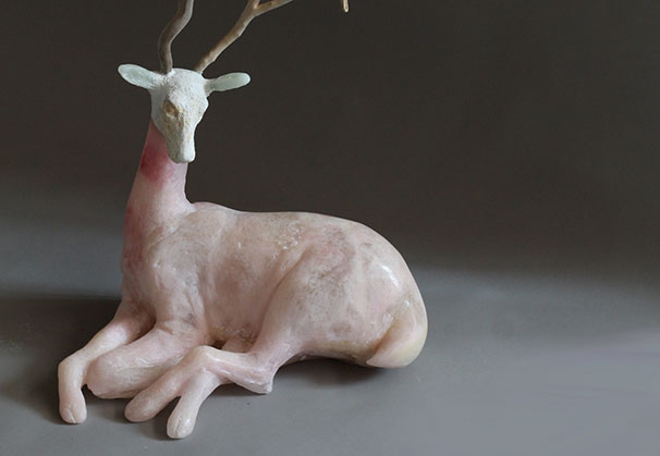 <i>PINK ANTLERED</i> (seated deer with antlers), 2025; 28 x 14 x 9 inches; cast glass/mixed media