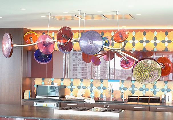 <i>Yo-Yo World</i>, 2022; 8 x 3 x 24 feet; blown glass, metal armature